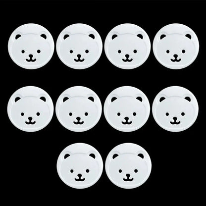 Full set of 10 white baby bear socket covers, designed for comprehensive child electrical safety in homes.