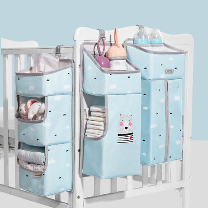 Baby bedside hanging storage organizer for crib, grey with star pattern, holds diapers, wipes, and bottles