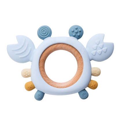 Collection of colorful silicone crab teethers for babies, shown with natural wood rings for chewing