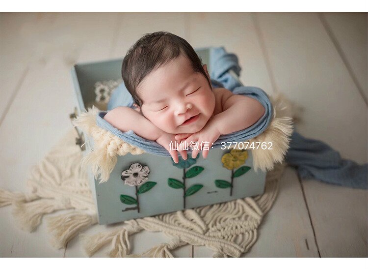 Boho knitted cotton baby blanket in beige, versatile as photo backdrop or nursery accessory
