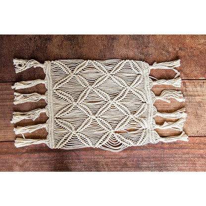 Close-up of a textured boho knitted baby blanket, a cozy and stylish photo prop