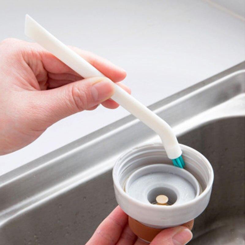 Baby bottle and nipple cleaning brush set with durable nylon bristles, ergonomic handle and compact design.