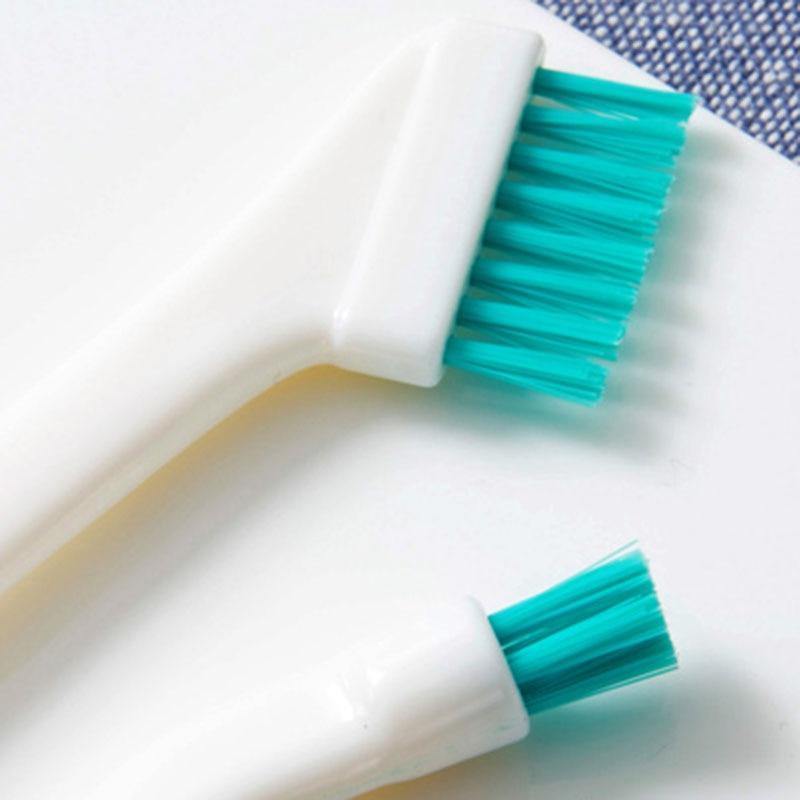 Close-up of baby bottle and nipple cleaning brush set, highlighting soft bristles and non-slip handles.