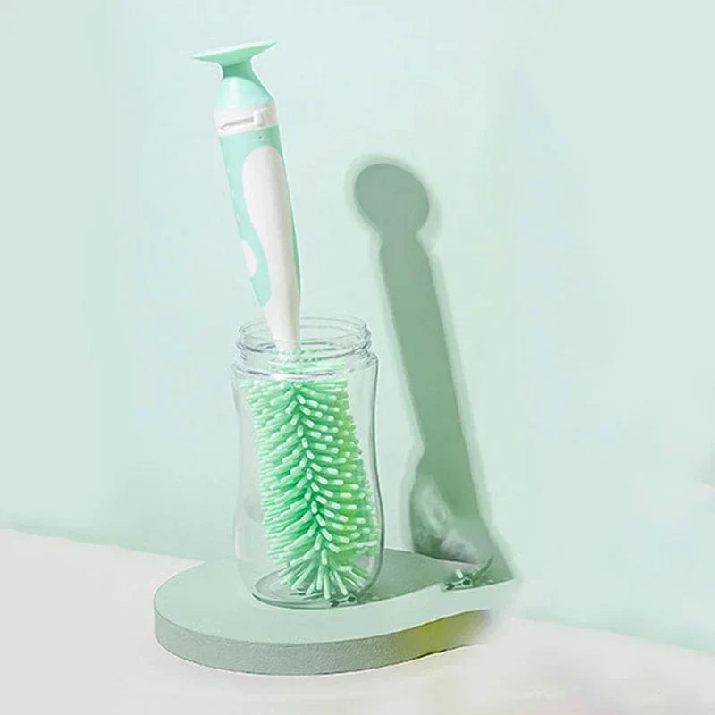 Detail shot of the rotating handle on a baby bottle brush, part of a pacifier cleaner set
