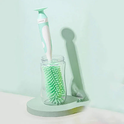 Detail shot of the rotating handle on a baby bottle brush, part of a pacifier cleaner set