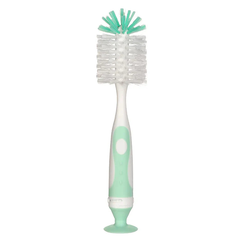 Compact bottle cleaning brush for baby bottles, featuring a strong suction base for countertop stability