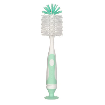 Compact bottle cleaning brush for baby bottles, featuring a strong suction base for countertop stability