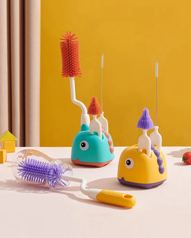 A hand holding the baby bottle silicone brush, demonstrating its 360° rotation feature.