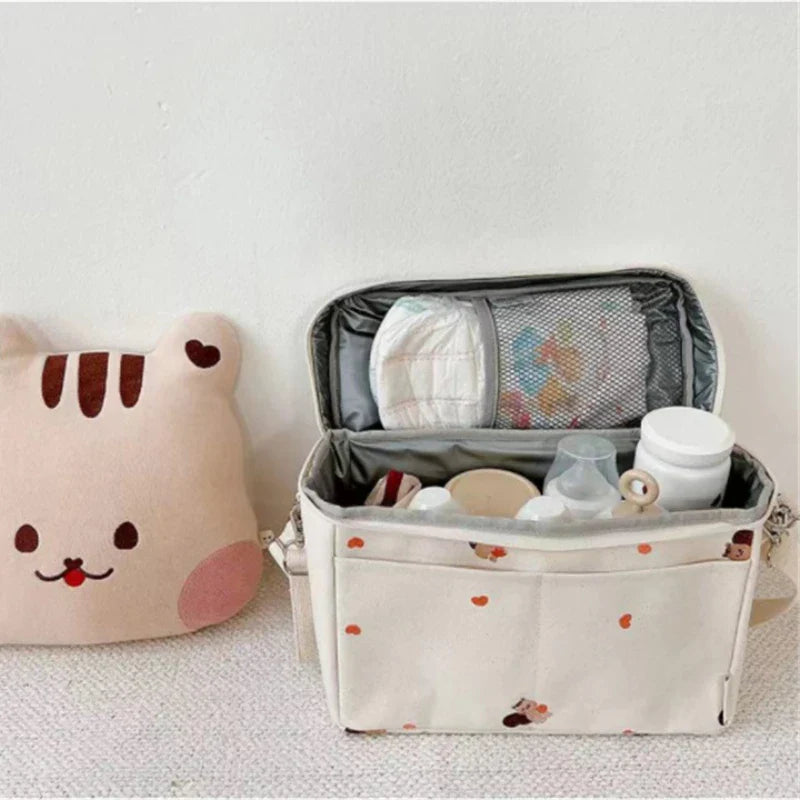 Baby cooler bag with secure zipper, designed for stroller use, keeps baby bottles cool.