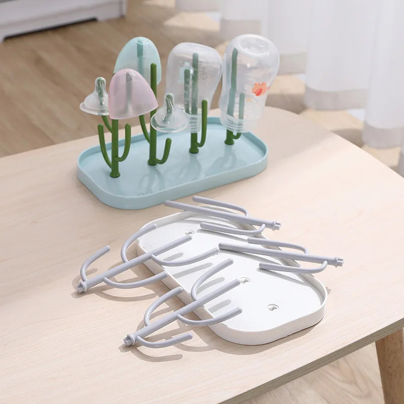 Close-up of a baby bottle drying rack showcasing its removable drainer tray for easy cleaning & hygiene
