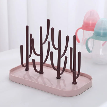 Modern baby bottle dryer rack in a neutral color, designed for efficient air drying of all baby accessories