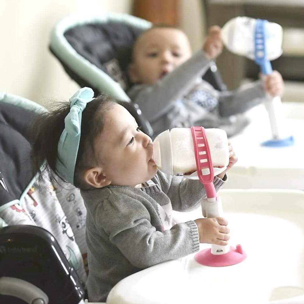 Baby bottle holder, hands-free, for infants, supporting independent feeding and reducing spills.