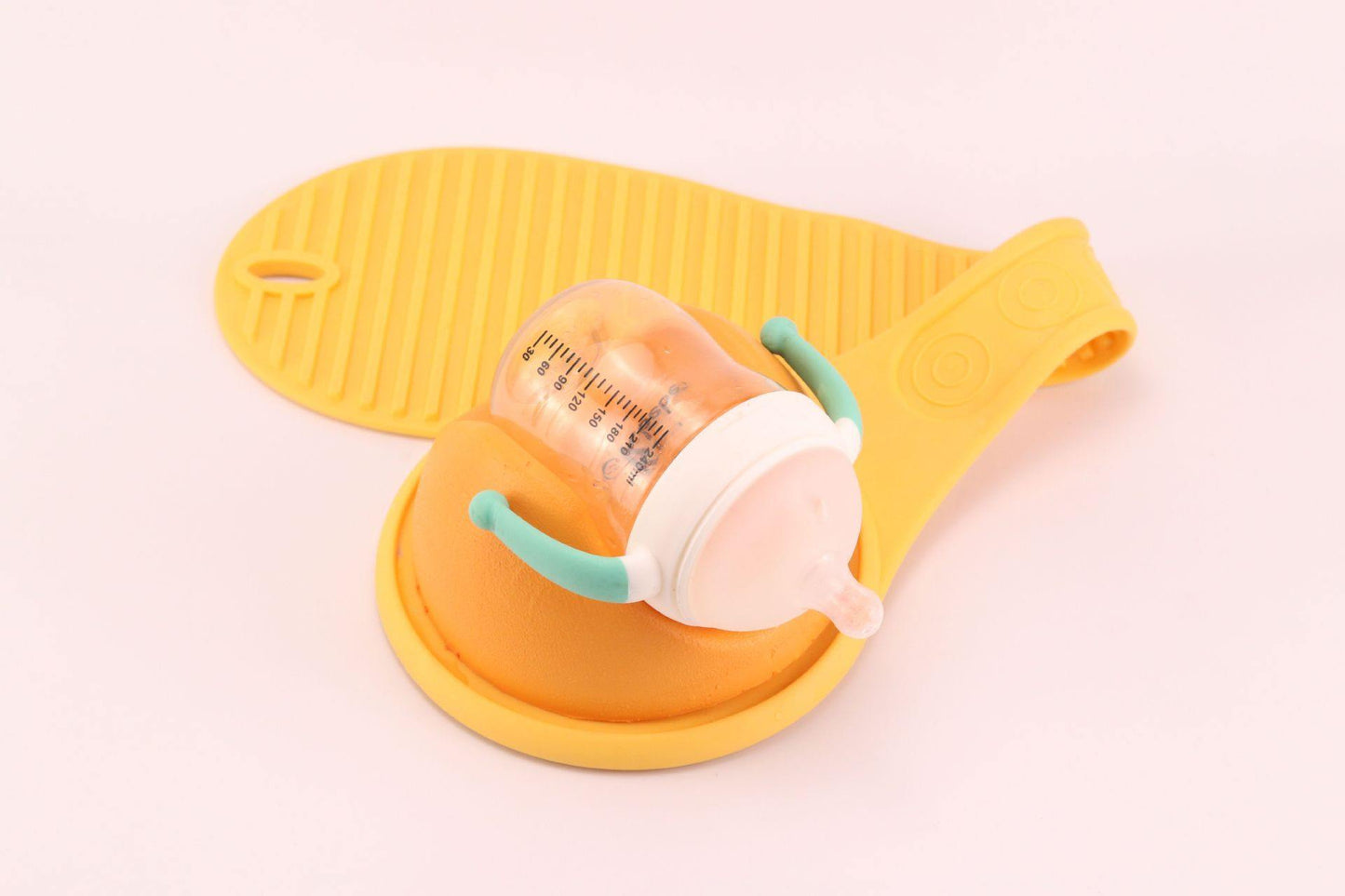 Ergonomic baby bottle holder for hands-free feeding, a practical parenting solution.