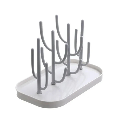 Efficient baby bottle drying rack with pacifier holder, white finish, essential nursery storage for baby items