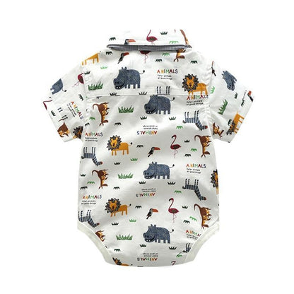 Close-up of animal print fabric on a baby boy's romper with suspender shorts, summer wear