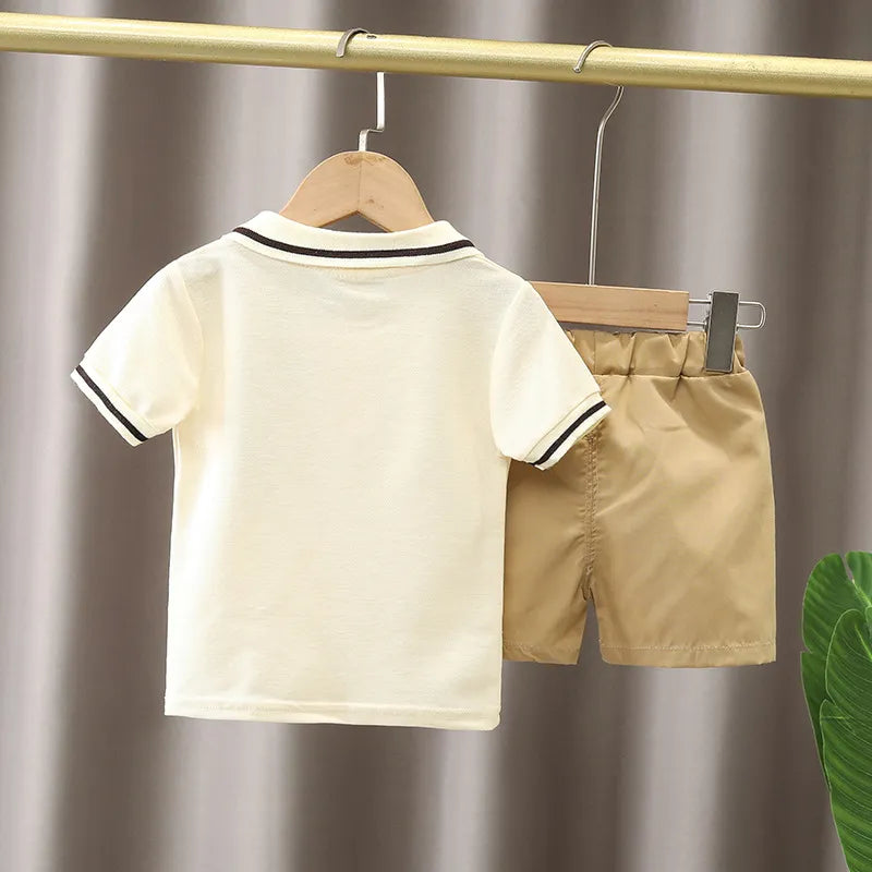 Cute blue cartoon t-shirt and yellow shorts set for infant boys, ideal for summer play.
