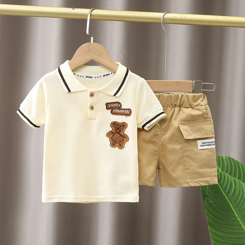 Comfortable cotton baby boy's summer outfit: short-sleeve cartoon t-shirt and pull-on shorts.