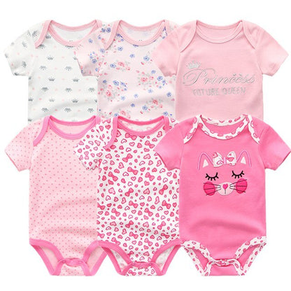 Close-up of the snap buttons on a practical baby boy cotton onesie, easy diaper changes