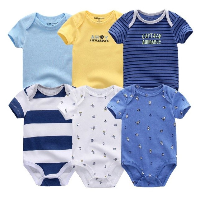Stack of folded baby boy cotton onesies, showing different designs from the 6-pack