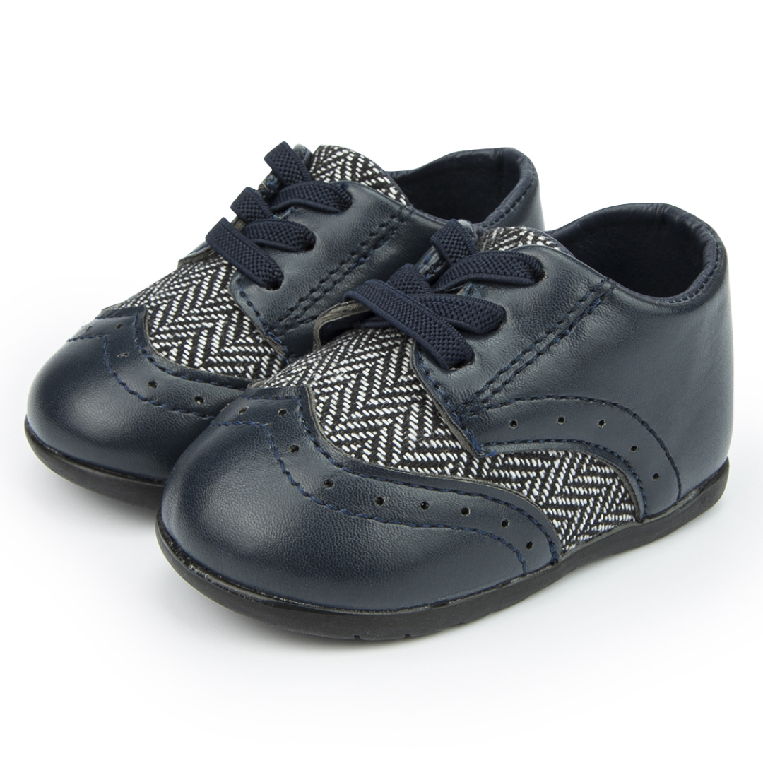 Baby boy first walker leather shoes with colorful Aztec design, soft sole for optimal infant foot development.