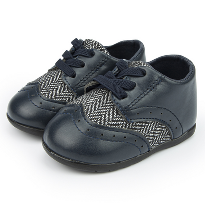 Baby boy first walker leather shoes with colorful Aztec design, soft sole for optimal infant foot development.