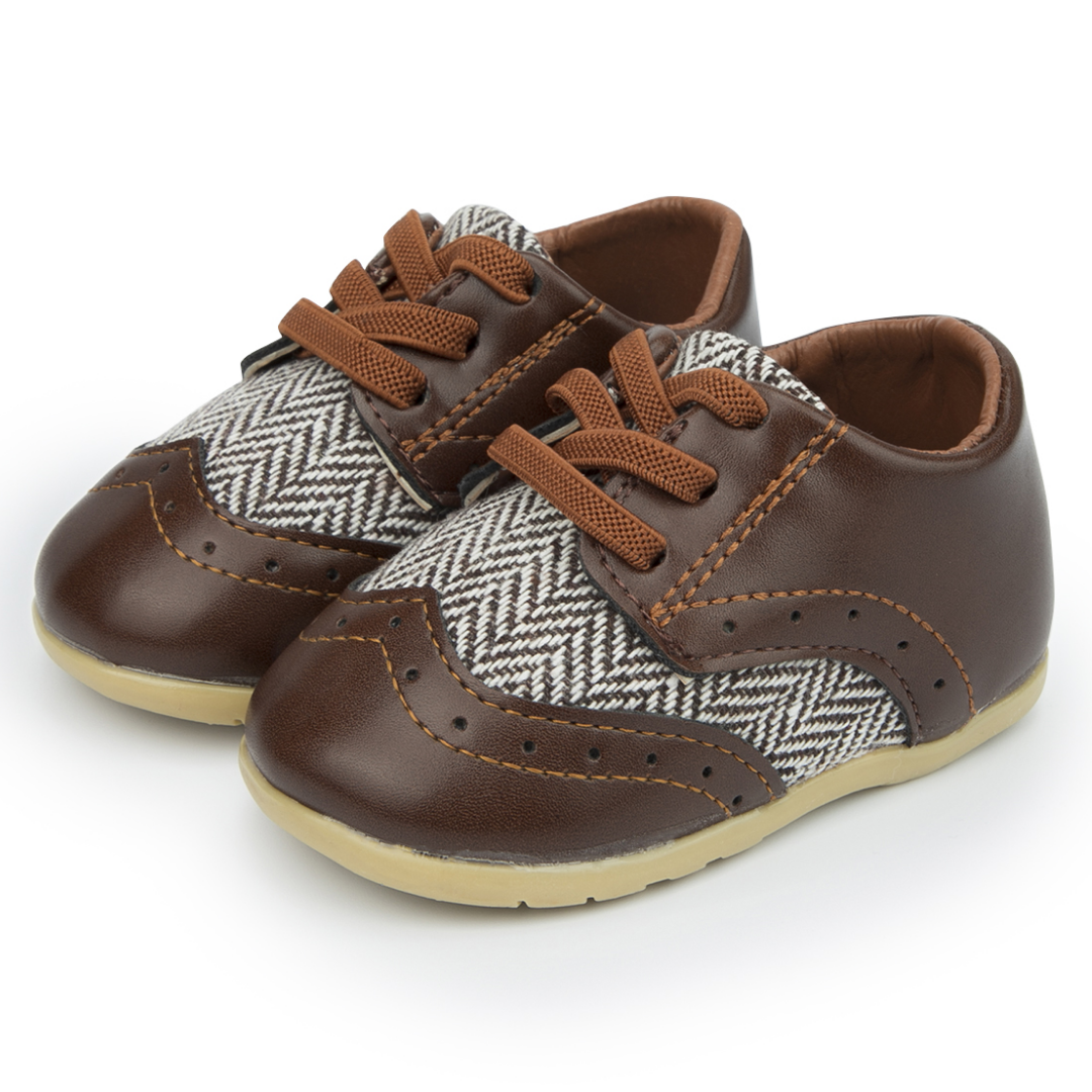 Infant boy's soft sole leather shoes, anti-slip first walkers with unique Aztec patterns for new walkers.