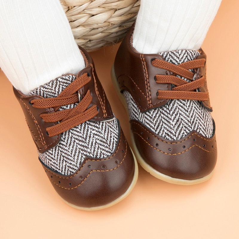Toddler boy leather shoes featuring a vibrant Aztec design, perfect anti-slip first walkers for baby boys.