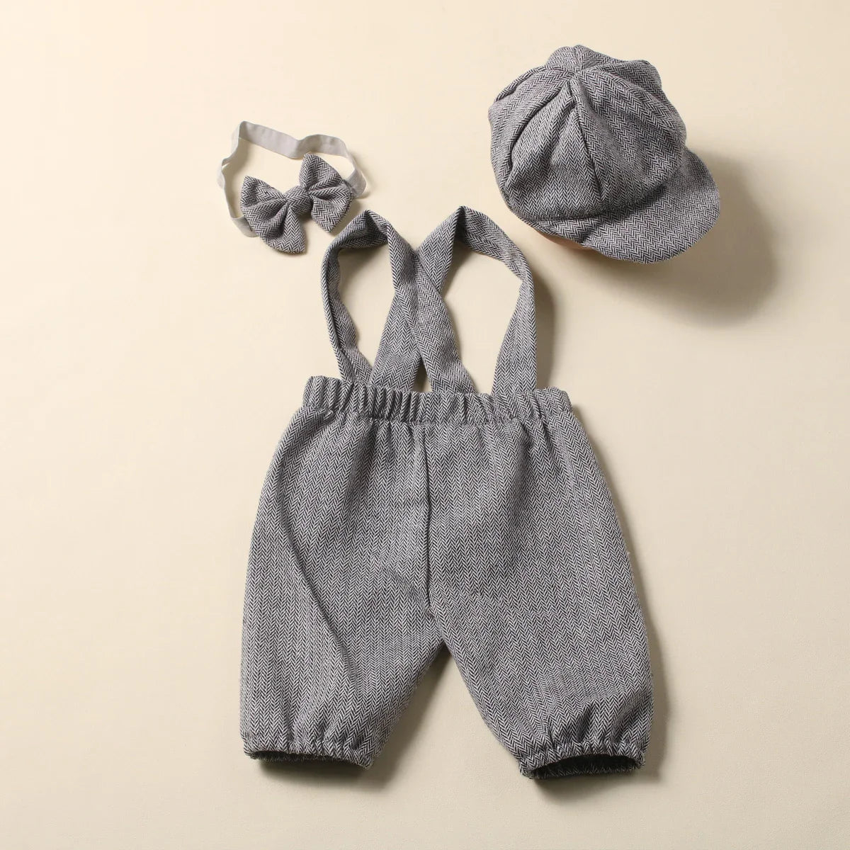 Gentleman photography outfit for baby boy, complete with stylish suspenders and bow tie