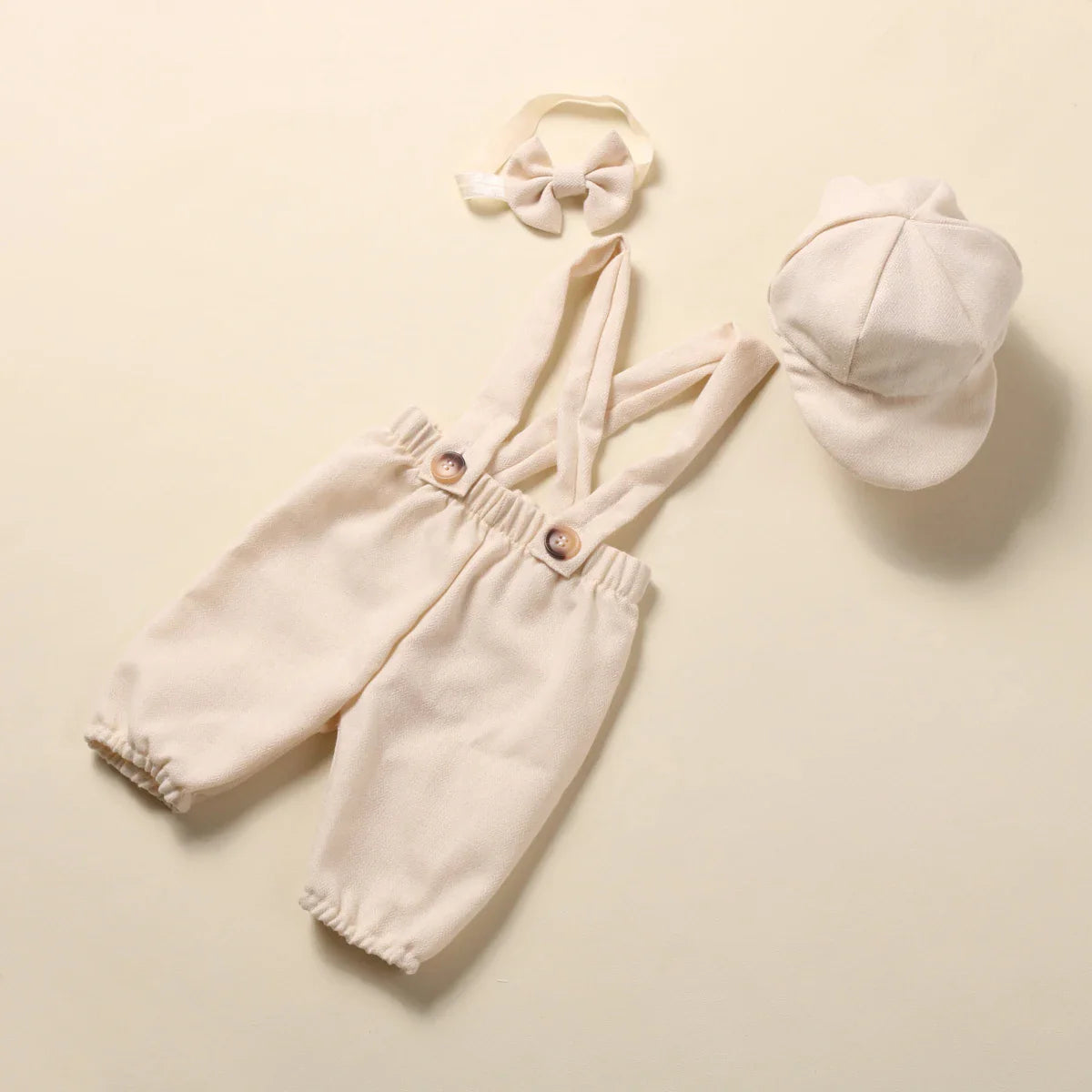Detailed image of baby boy's suspender pants from the gentleman photography outfit