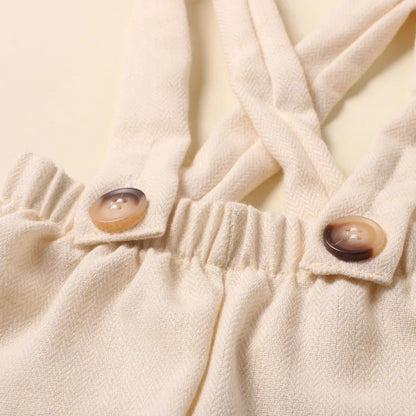 Cute newborn baby boy outfit featuring a small bow tie, essential for photo shoots