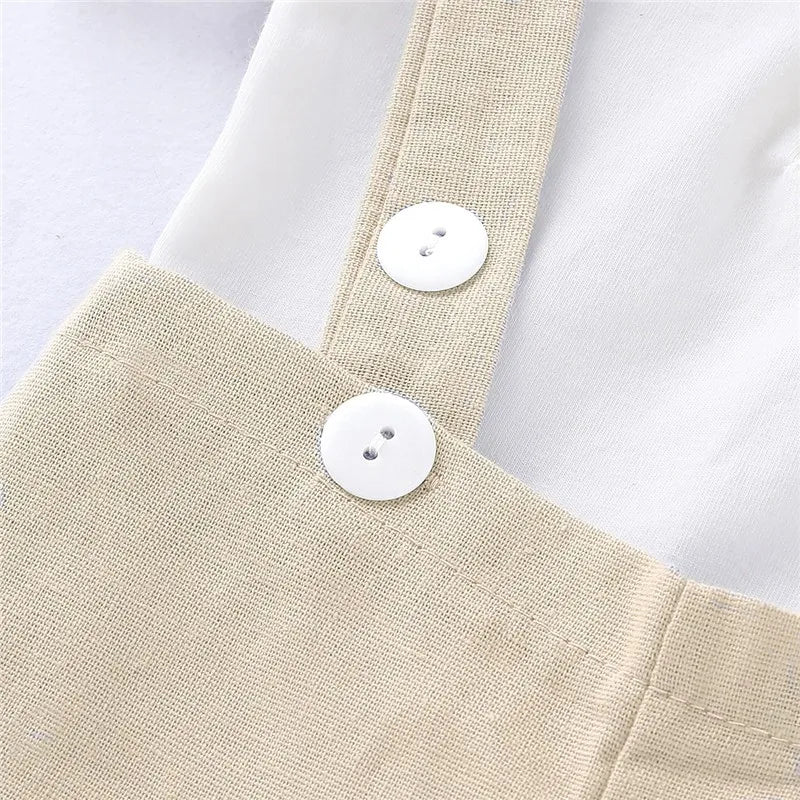 Cute baby boy gentleman romper for 0-24 month olds, featuring a smart lapel collar and adjustable suspenders
