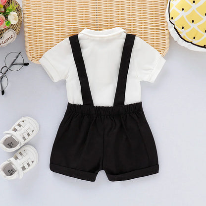 Studio shot of a baby boy gentleman romper on a hanger, highlighting its quality stitching and fabric