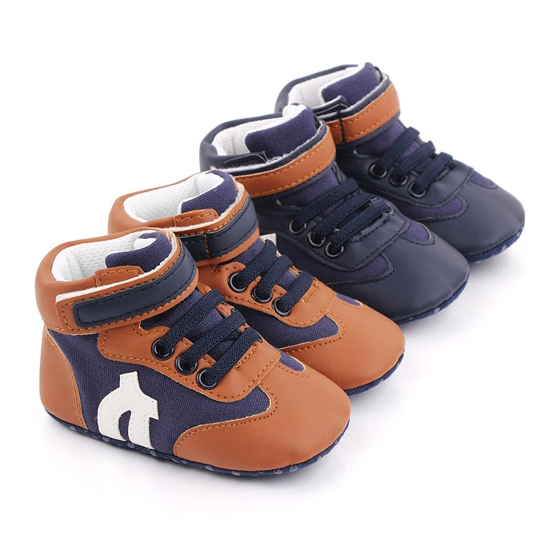 Baby boy hi-cut soft sole first walker sneakers in blue canvas, anti-slip for new walkers.