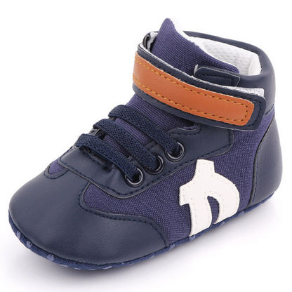 Close-up of a blue canvas soft sole hi-cut sneaker for baby boys, ideal first walker shoes.