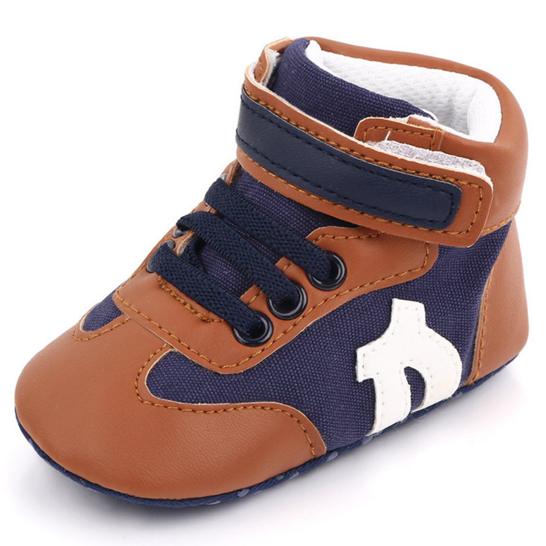 Pair of baby boy hi-cut first walker sneakers with soft anti-slip soles, perfect baby footwear.