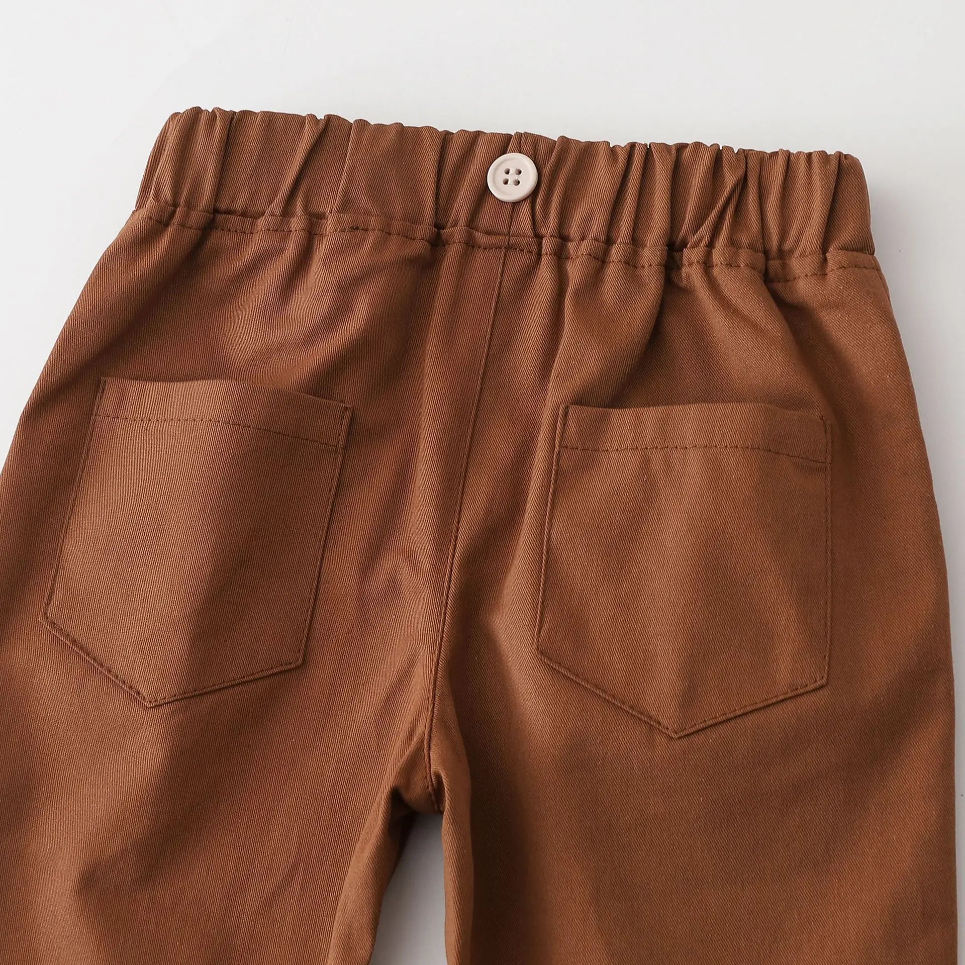 Cute baby boy enjoying the comfort of his bear ear romper and pants, perfect for everyday