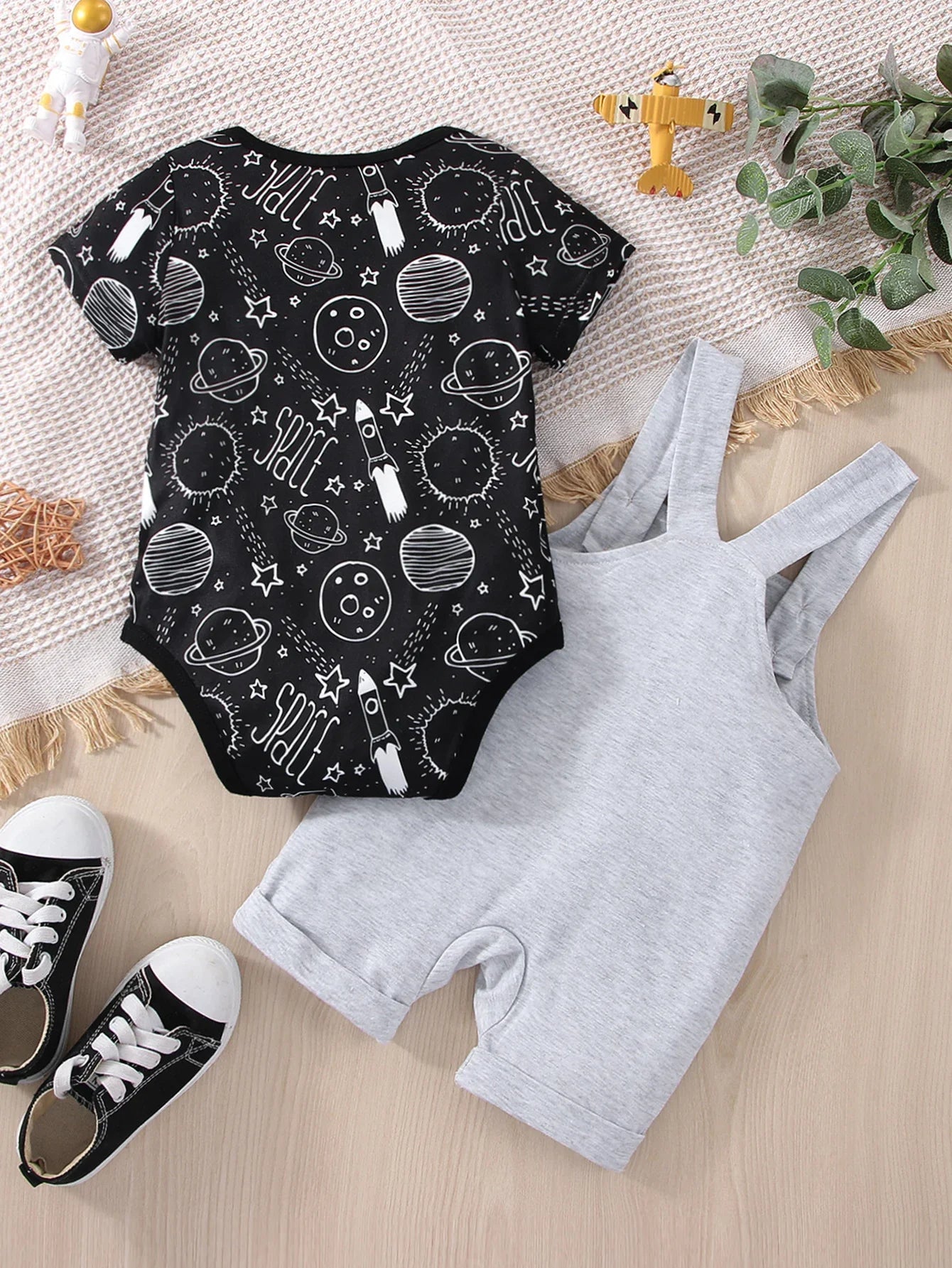 Baby boy astronaut romper with envelope neck for easy dressing, space adventure theme