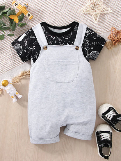 Smiling baby boy sitting up wearing his blue astronaut graphic romper, ready for exploration