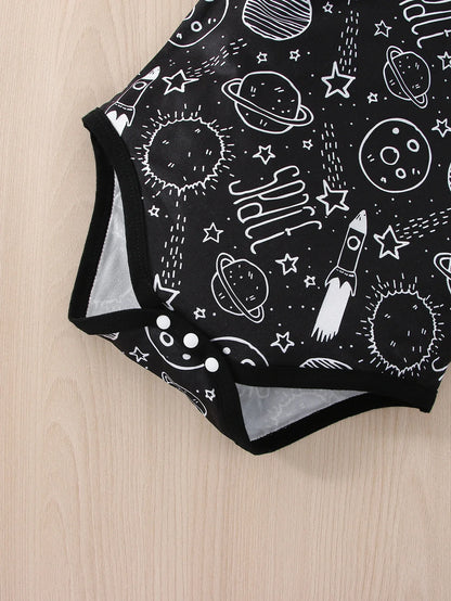 Side profile of baby boy in short sleeve astronaut romper, clear graphic, infant clothing