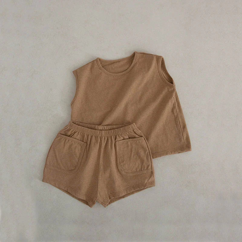 Toddler model wearing a summer two-piece cotton vest and elastic shorts set