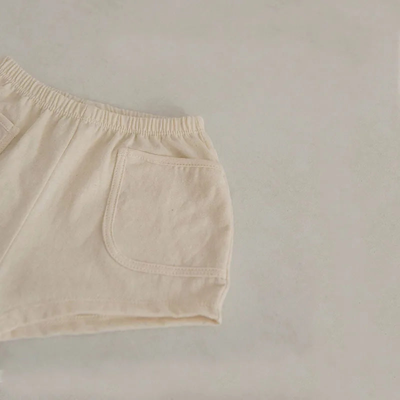 Back view of the blue cotton toddler shorts with comfortable elastic waistband