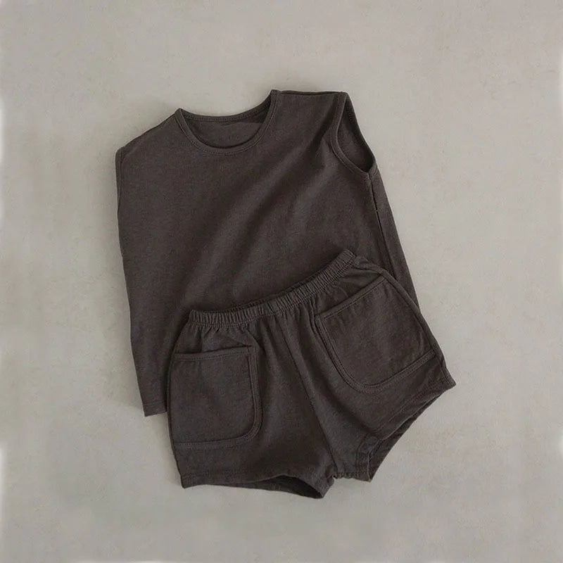 Detail of the soft, breathable cotton fabric of the baby boy's summer outfit