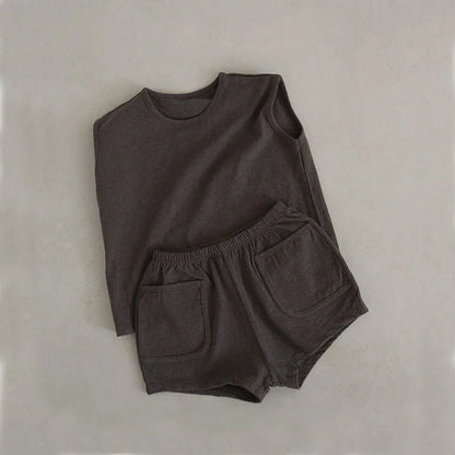 Detail of the soft, breathable cotton fabric of the baby boy's summer outfit