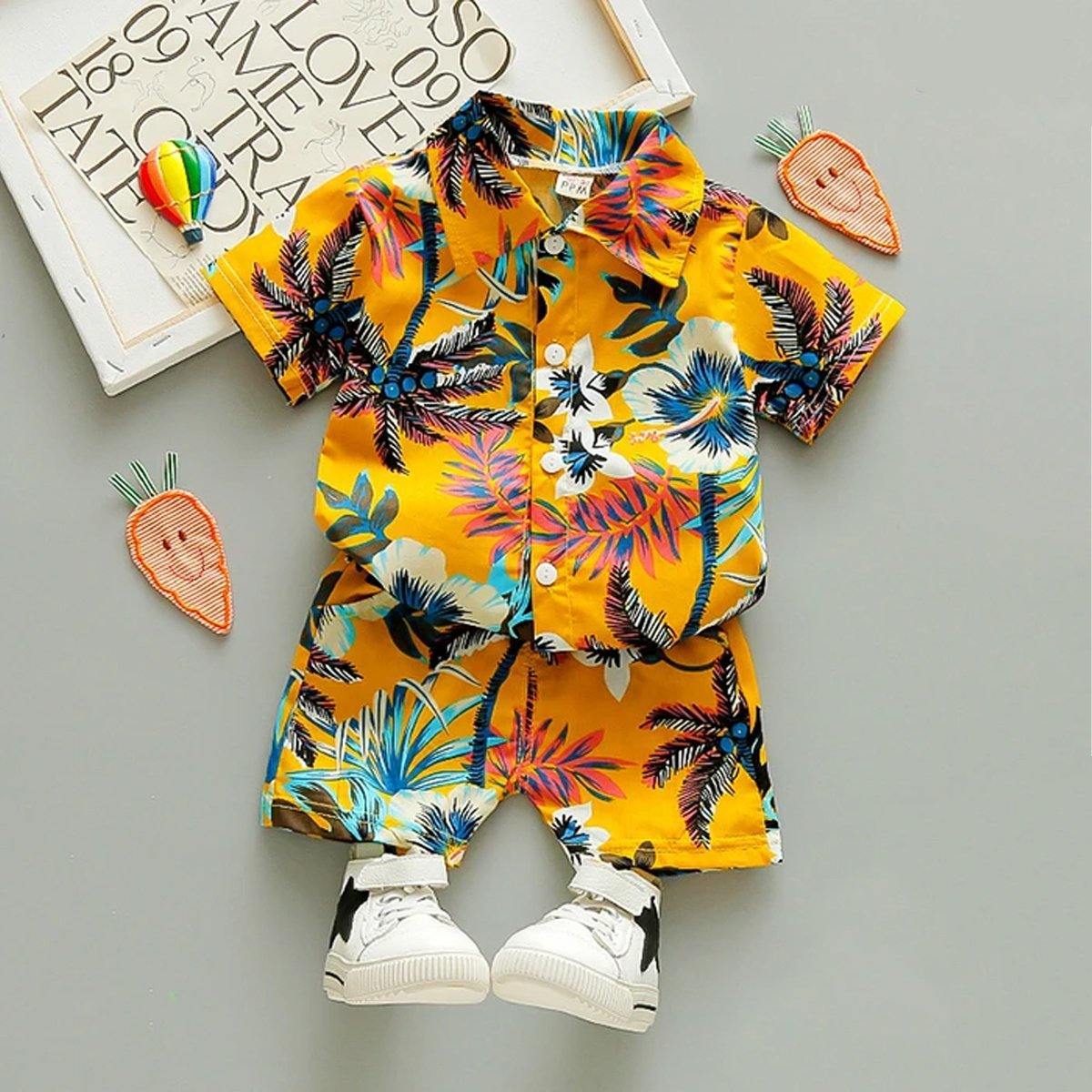 Baby boy in floral t-shirt & shorts outfit, perfect for summer beach wear, made of soft cotton.