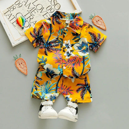 Baby boy in floral t-shirt & shorts outfit, perfect for summer beach wear, made of soft cotton.