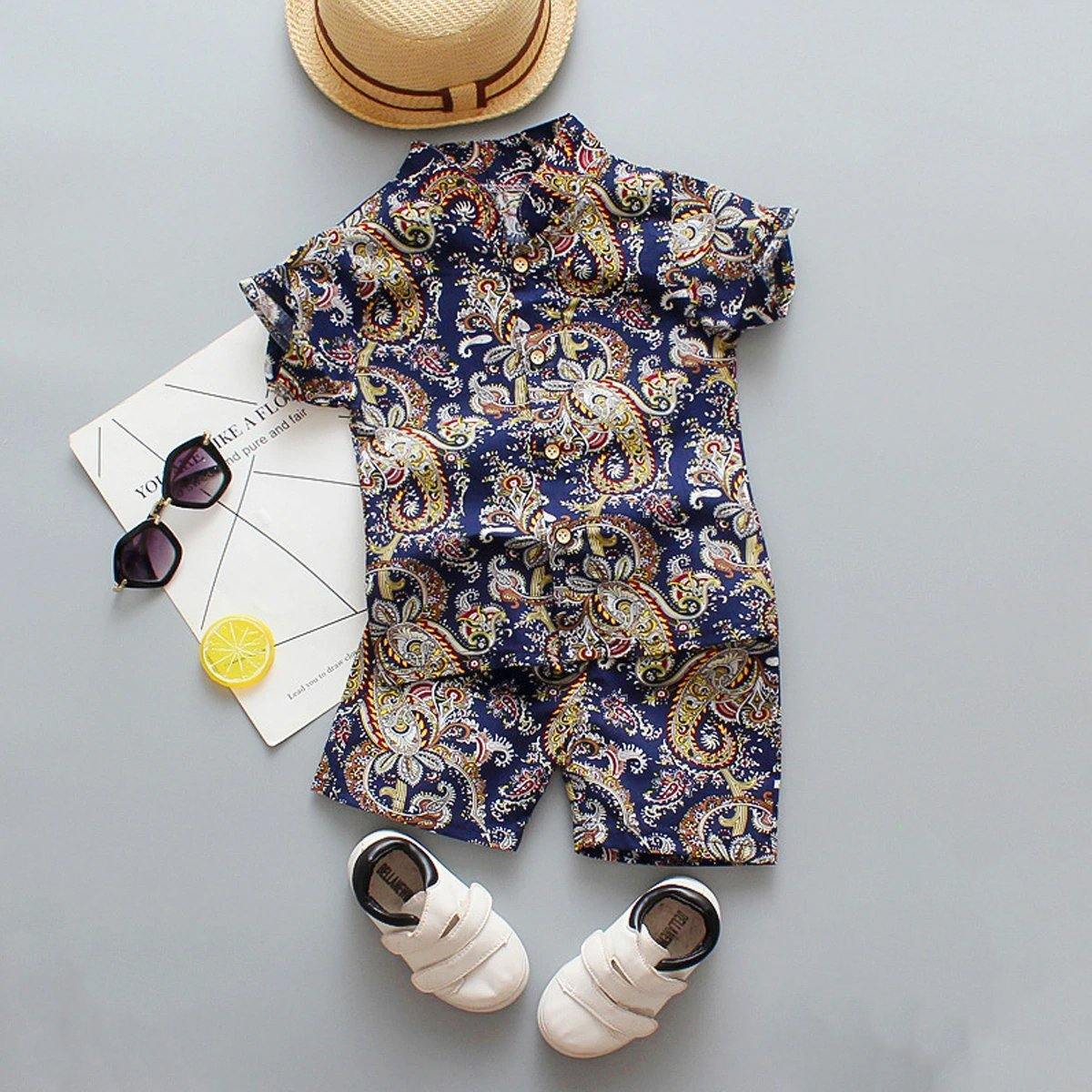 Baby boy fashion: white t-shirt with floral print & blue shorts outfit, adorable and breathable.