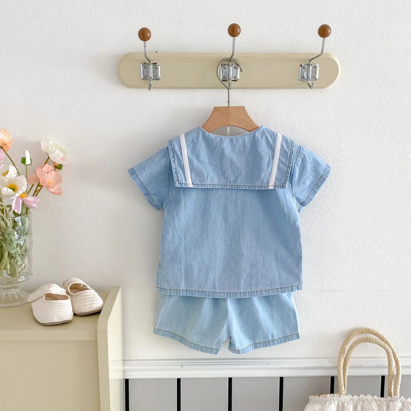 Korean style baby boy denim set, short sleeve top with sailor collar, elastic waistband shorts, flat lay