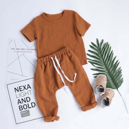 Baby girl in a soft, yellow and gray plaid cotton bodysuit, perfect for everyday wear