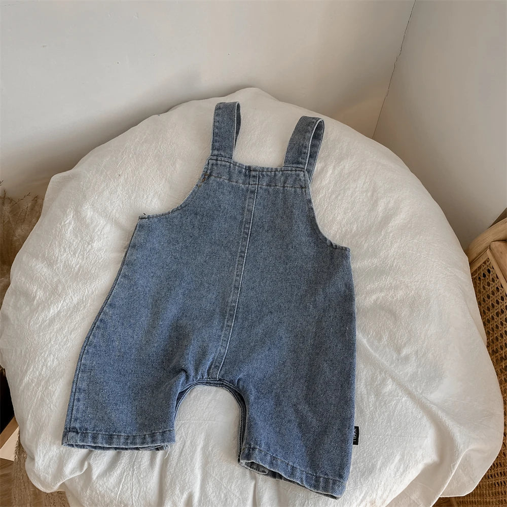 Front view of baby boy's loose fit suspender trousers, suitable for all seasons