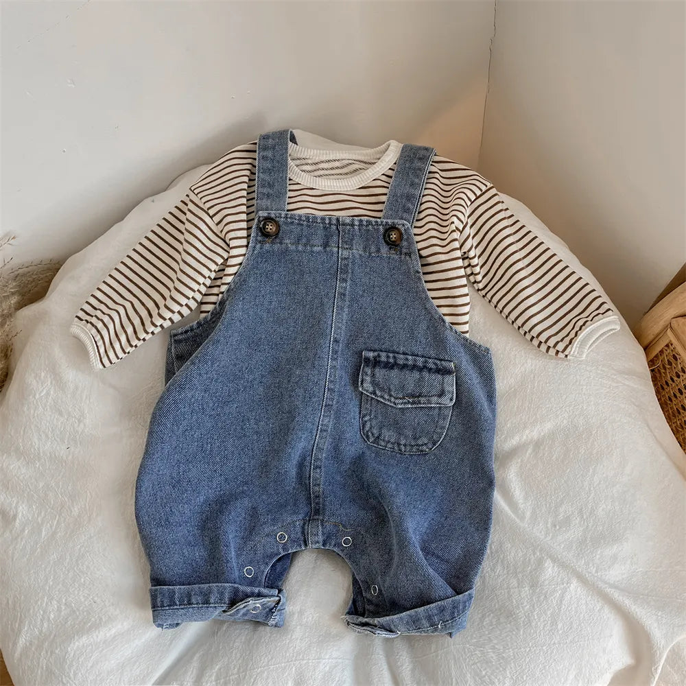 Close-up of adjustable button detailing on baby boy's suspender trousers